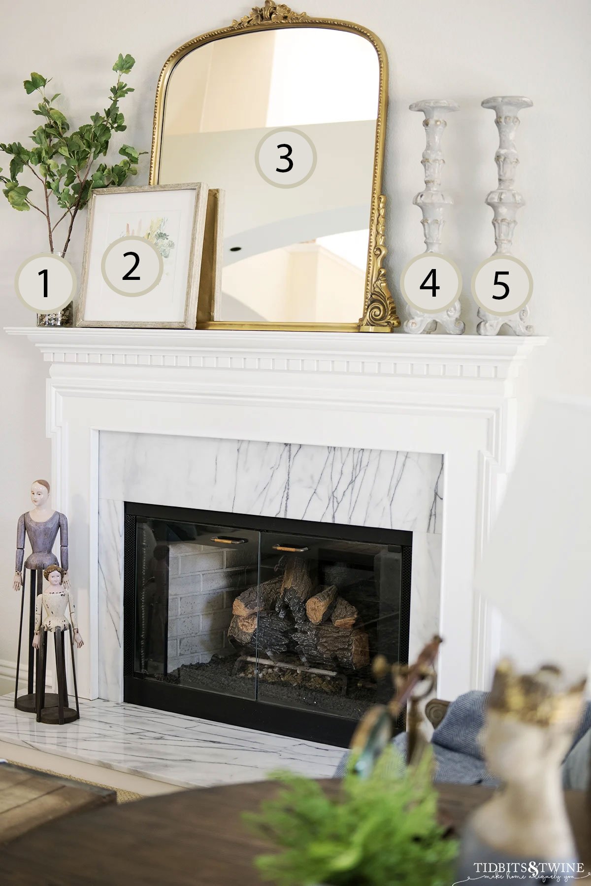 Spring fireplace mantel styled with five decorative elements using the rule of odds