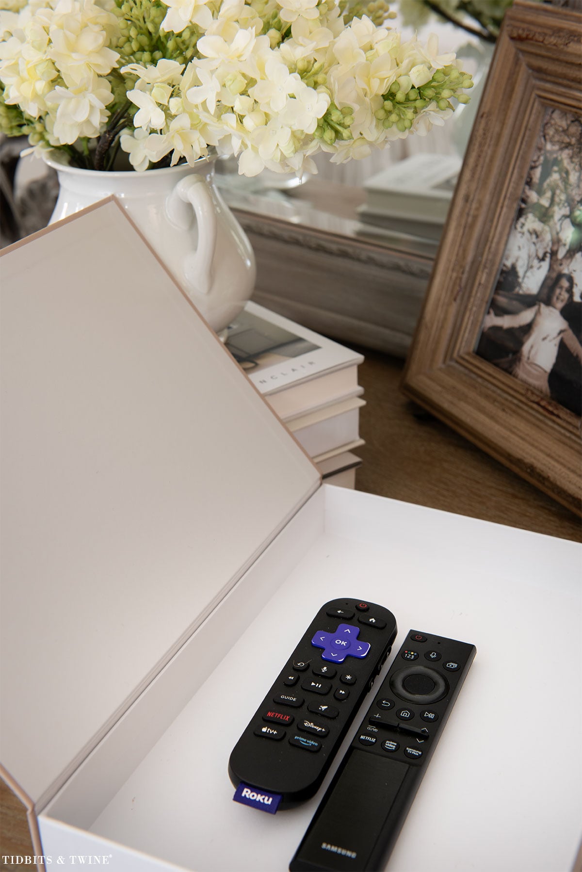 Stack of books used for height and storage in nightstand decorating