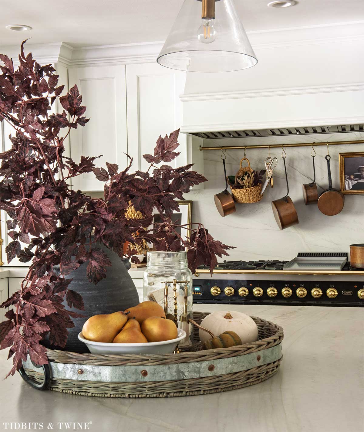 Fall kitchen island centerpiece with burgundy branches, faux pears and white pumpkins